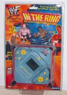 WWF In The Ring Electronic Handheld Game   Stone Cold vs. The Rock (1999): Toys & Games