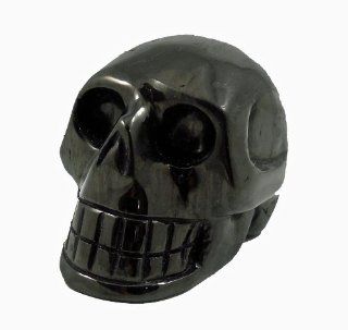 Hand Carved Skull Sculpture Made Out of Jet, a Natural Organic Fossilized Matter. Like a Crystal Stone Rock Carving, Jet has New Age Metaphysical Healing Properties. This Artistic Lapidary Piece is also Jet Black in Color and Highly Polished. It Measures A